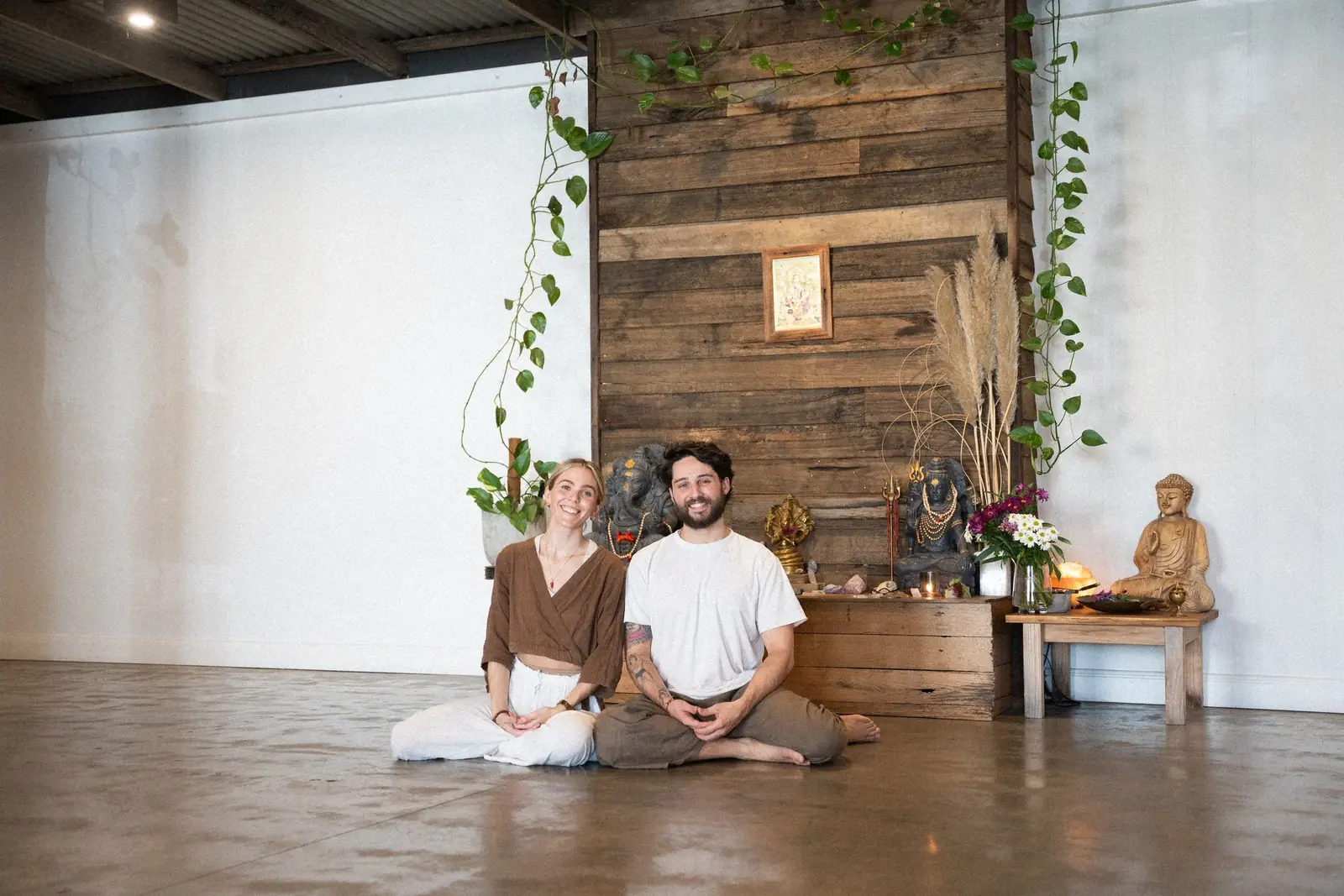 Aaron and Paige sitting together in the Berwick studio
