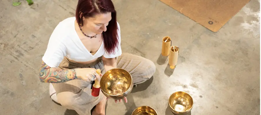 Brass singing bowls being played