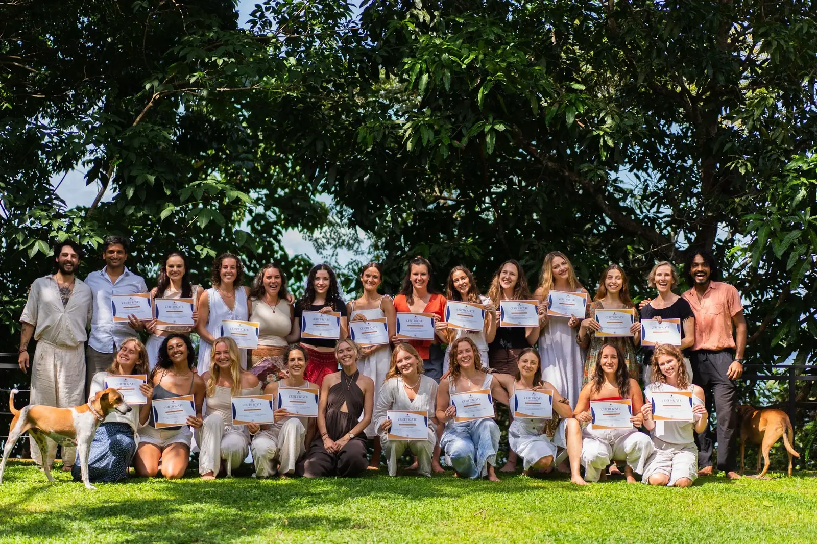 A graduating teacher training group holding certificates in Sri Lanka