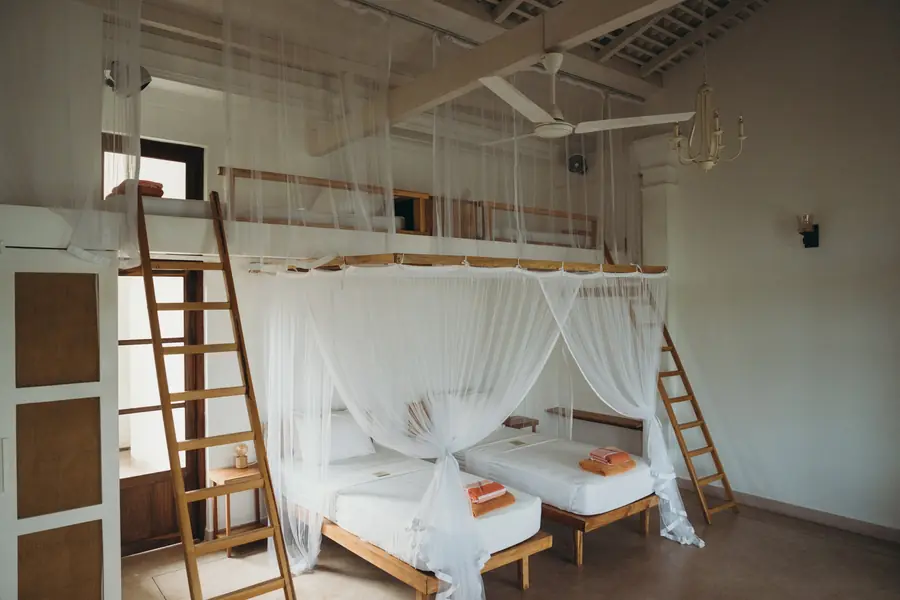 A light-filled room with a canopy bed