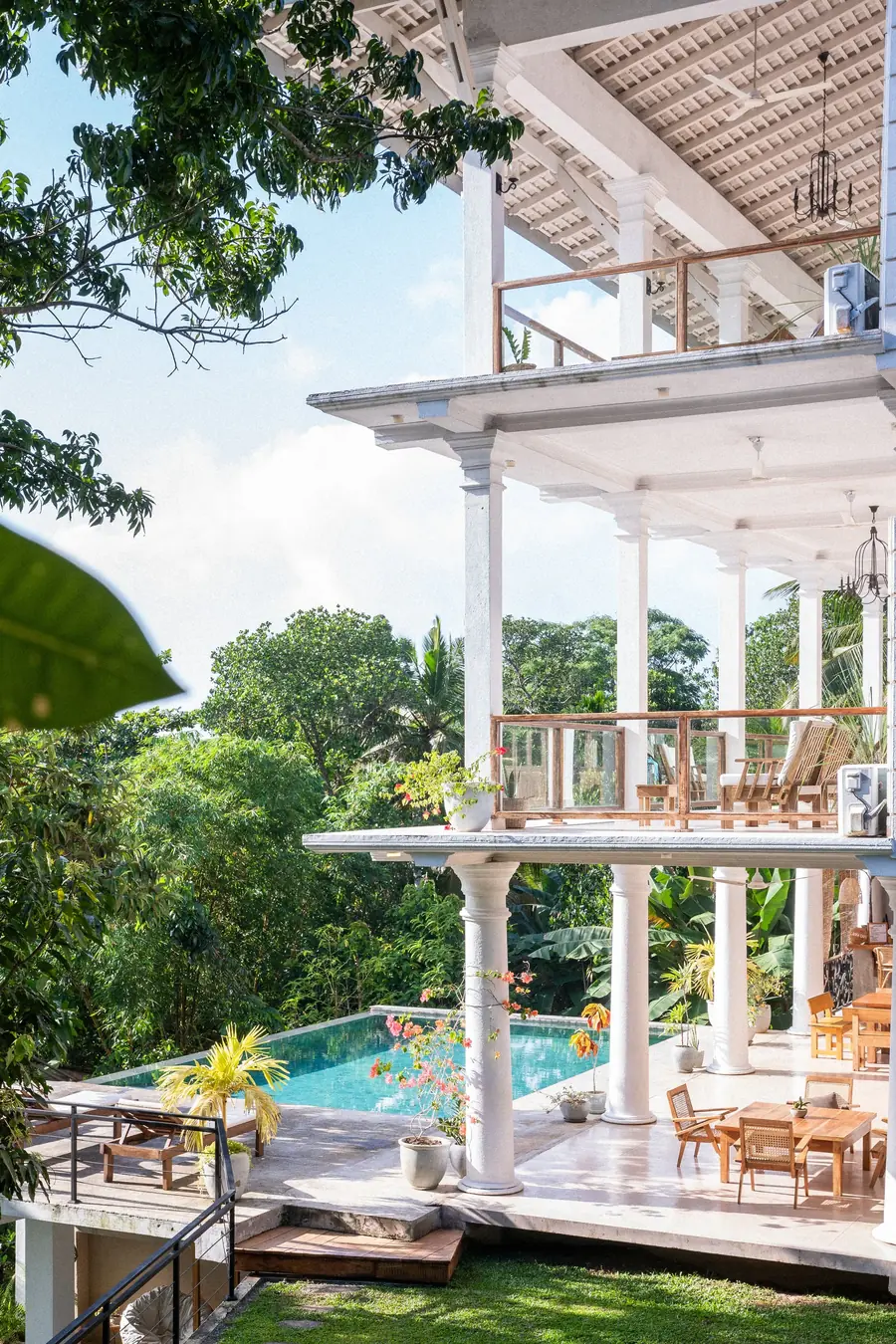 The white colonial retreat building and pool at Lanka Yoga