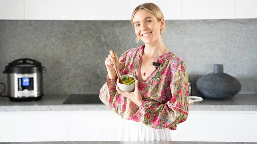 Paige smiling with a bowl of nourishing food