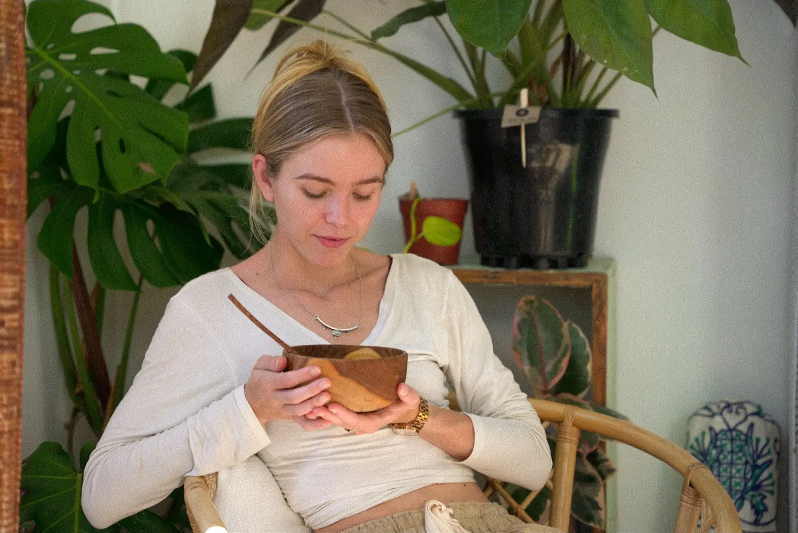 Paige holding a warm bowl of food at home