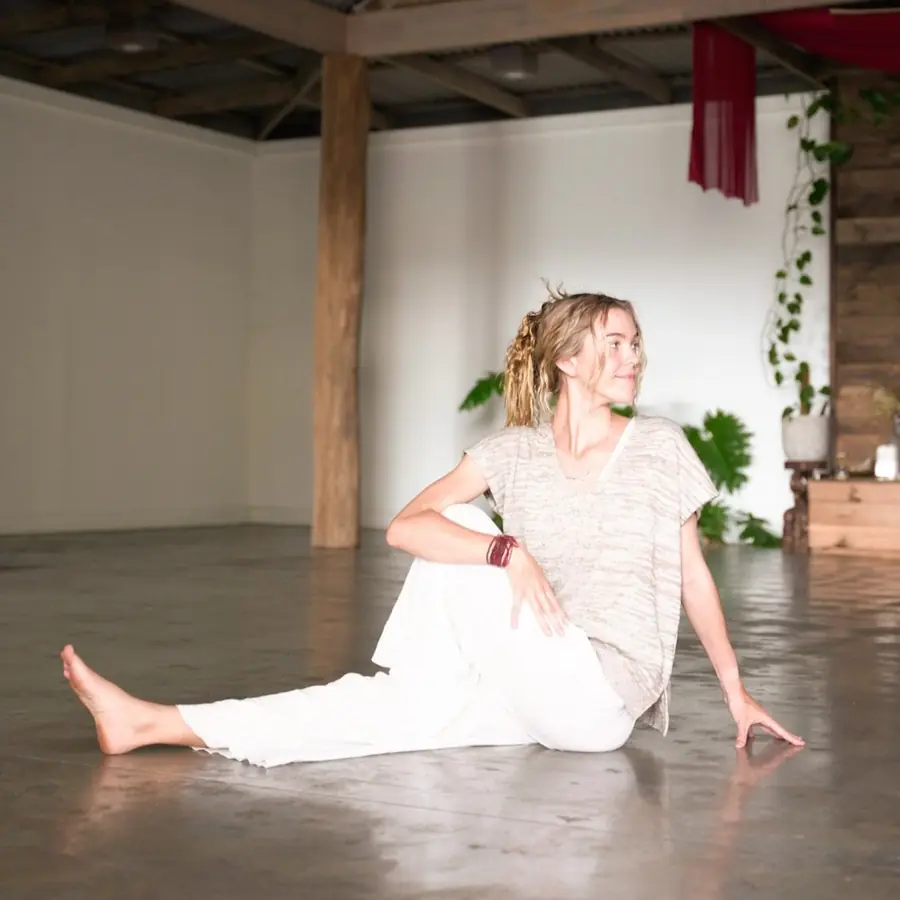 A student in a gentle seated twist