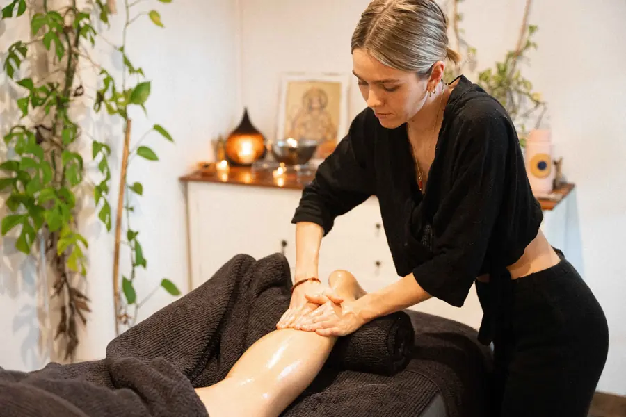 Paige giving a treatment in the candlelit treatment room