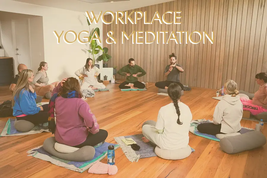 A workplace team practising yoga together